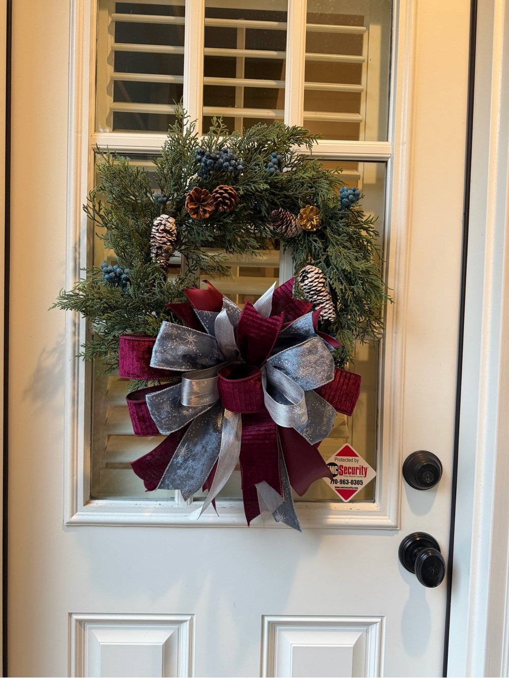 Evergreen Holiday Wreath with Burgundy and Silver Bow